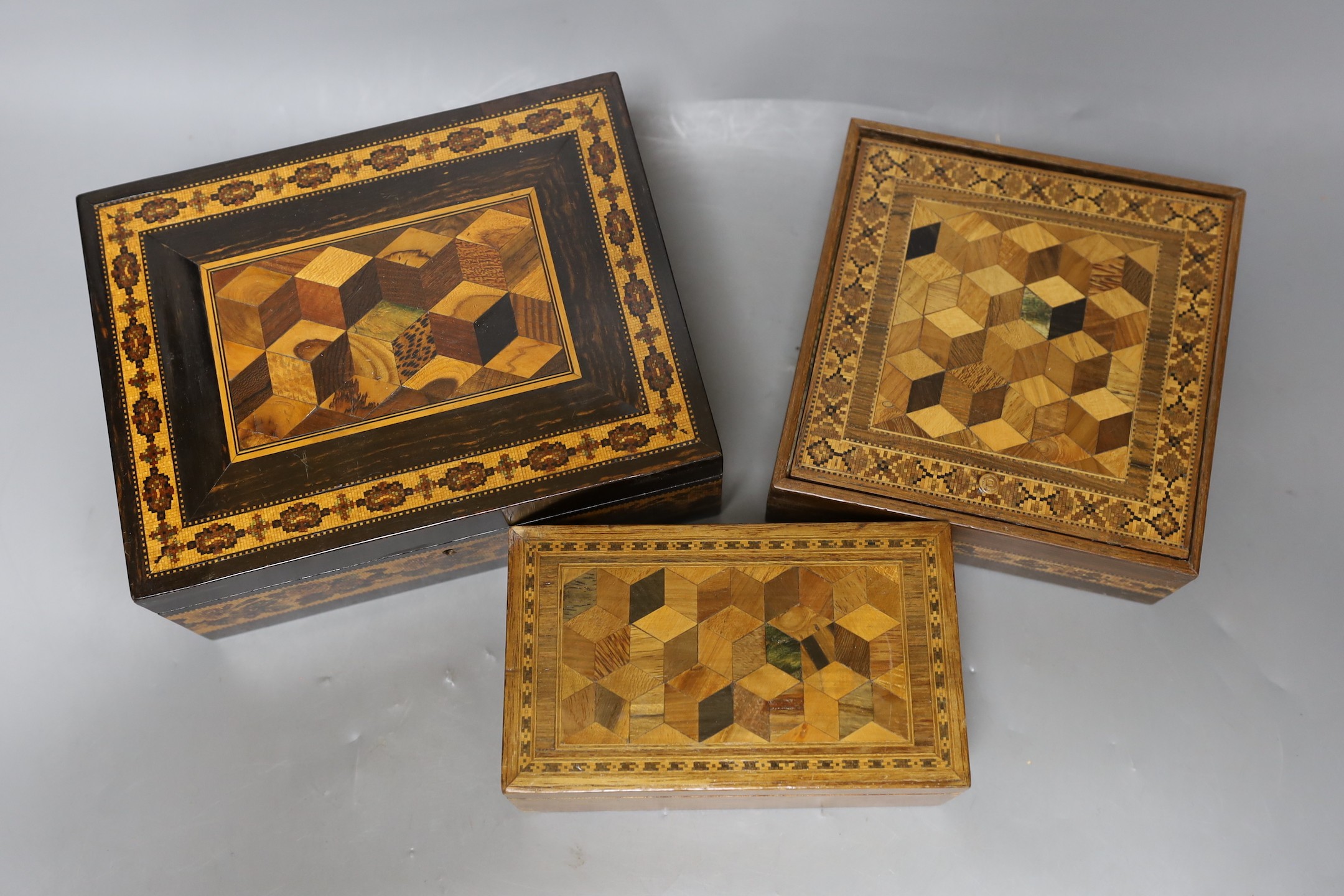 Three 19th century Tunbridge ware perspective cube marquetry boxes, largest 20cm